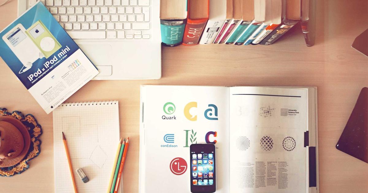 Organized desk with devices representing business systems and ERP